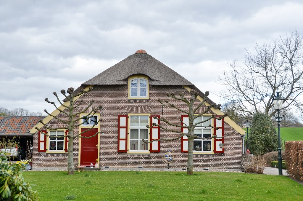 A traditional and restaurated old Dutch farm with sheep in spring: see next photo