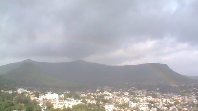 Rainbow and rain over the city...small sized photograph