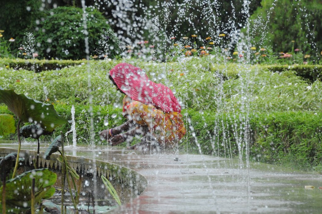 cleaning the fountain at Saheliyon ki bari, garden