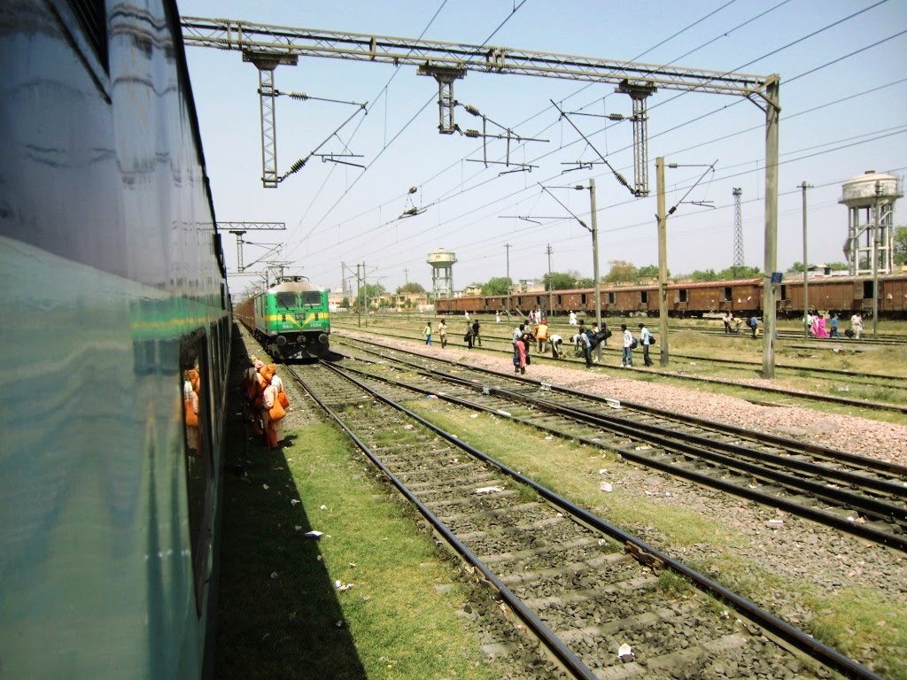 Passengers crossing the rails-tracks