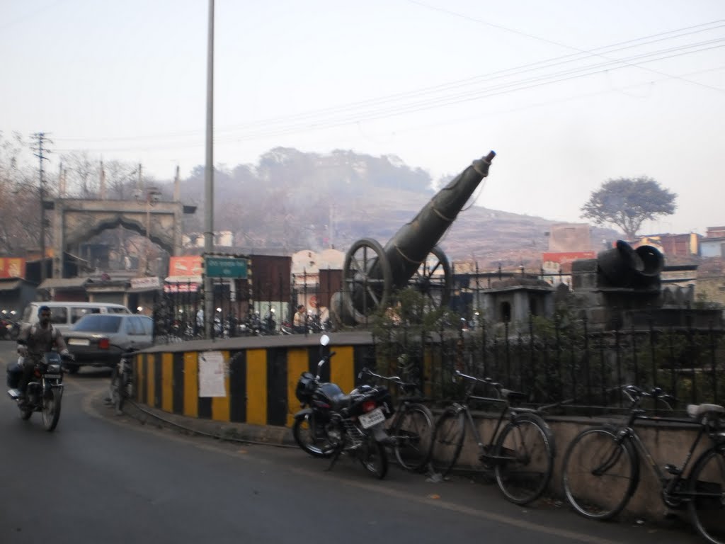 Cannon at foothills and Gate arch of Parvati.
