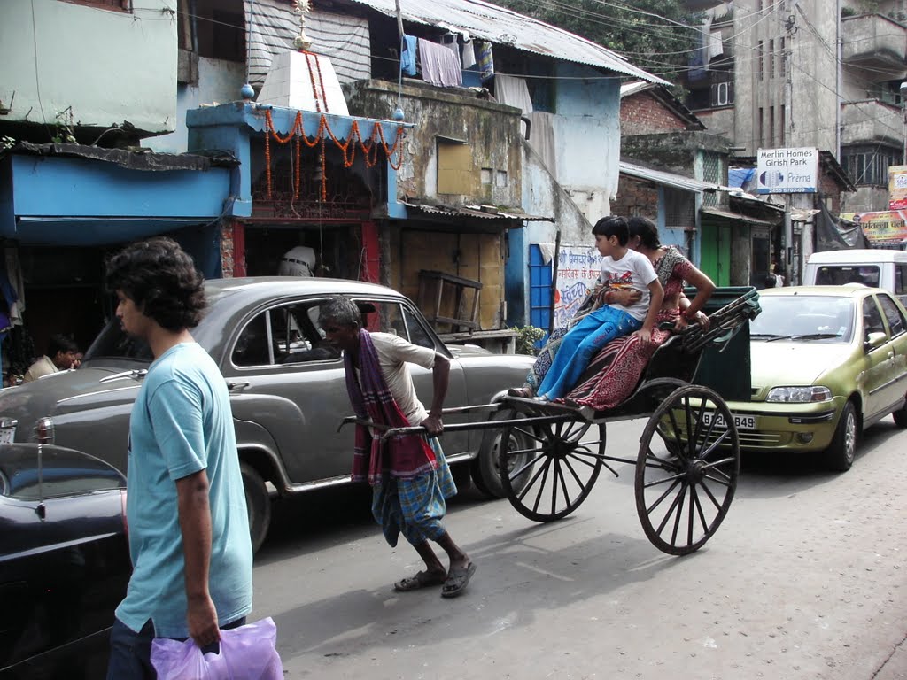 Hand rickshaw. Kolkata 2008. I used a rickshaw once but  wonder if it is an inhuman way of getting around, or is it a chance for someone to make a meagre living in a massively over populated city?
