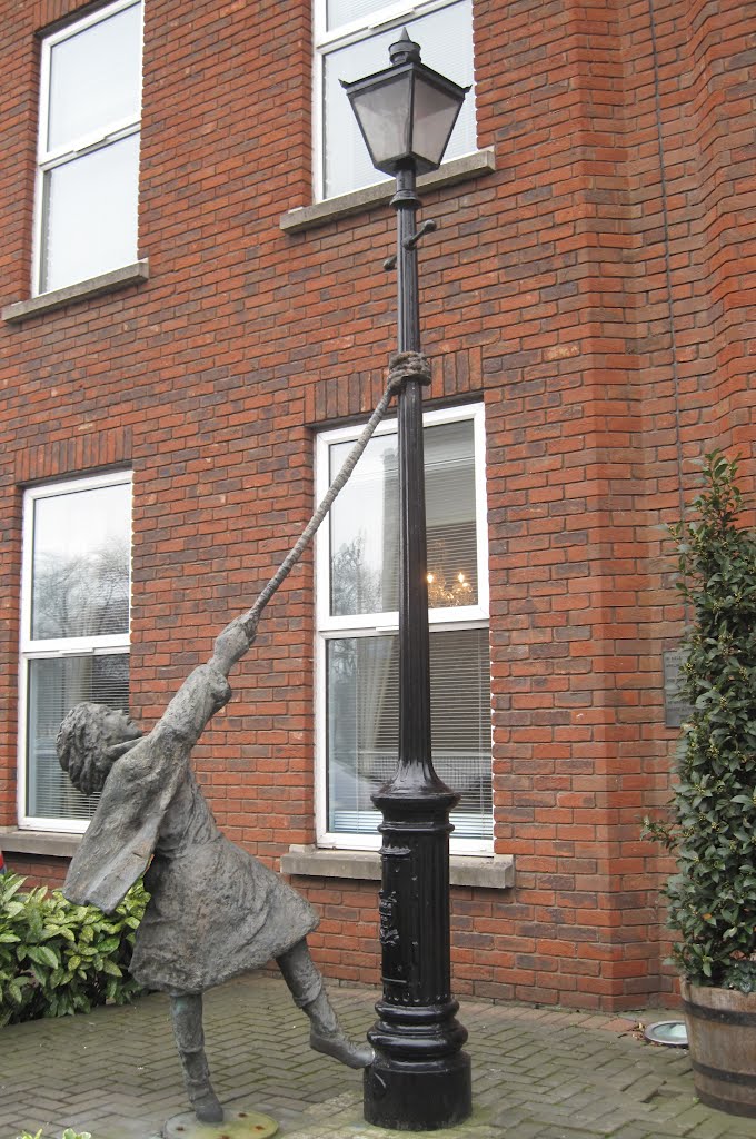 Young Girl Swinging On A lampost Mount St Crescent Dublin Ireland