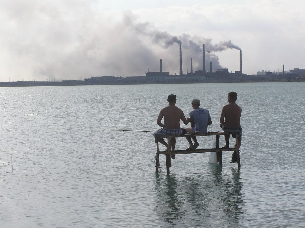Fishermen with Smoking Stacks in Background