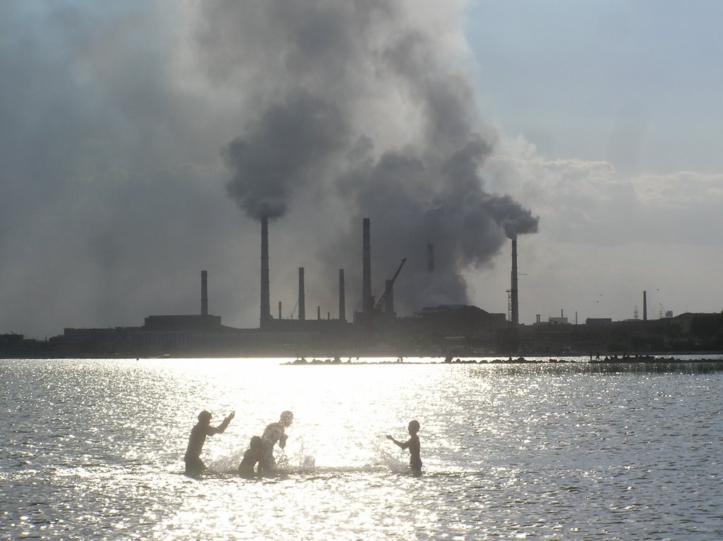 Swimmers with Smoking Stacks in Background
