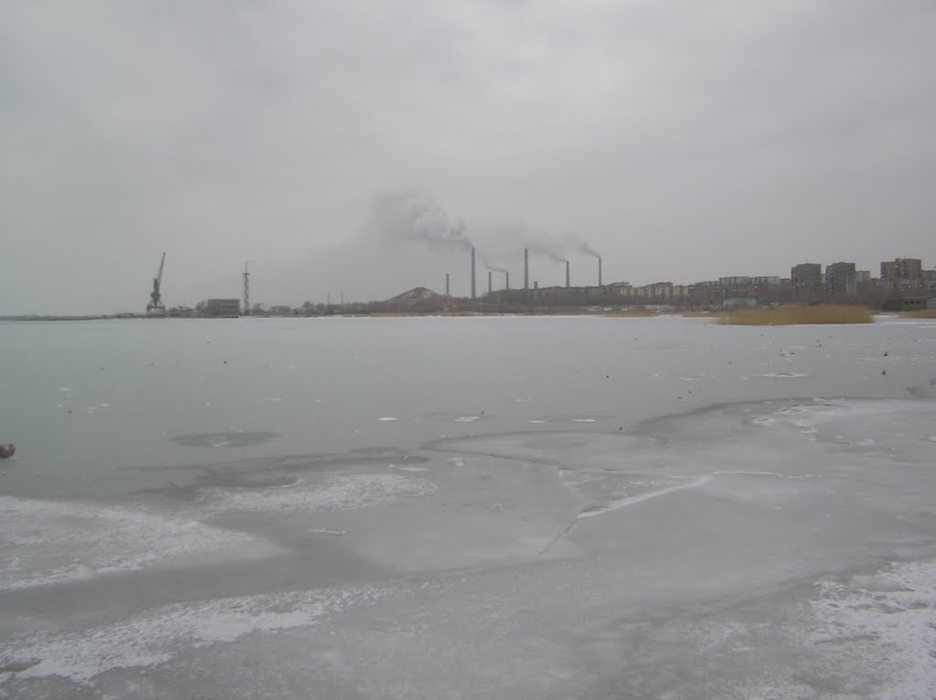 Lake Balkhash frozen with Smoke Staks smoking as always