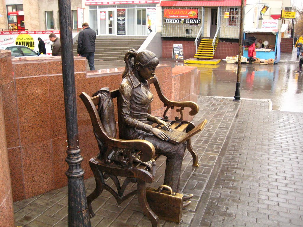 Sculpture of student with notebook