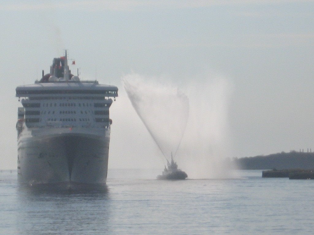 Queen Mary II Greeted by the Tug Atlantic Spruce arriving at Saint John Oct,2006. This picture was taken from the Market Slip.