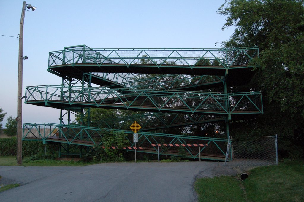 Ramps that lead up the green pedestrian bridge