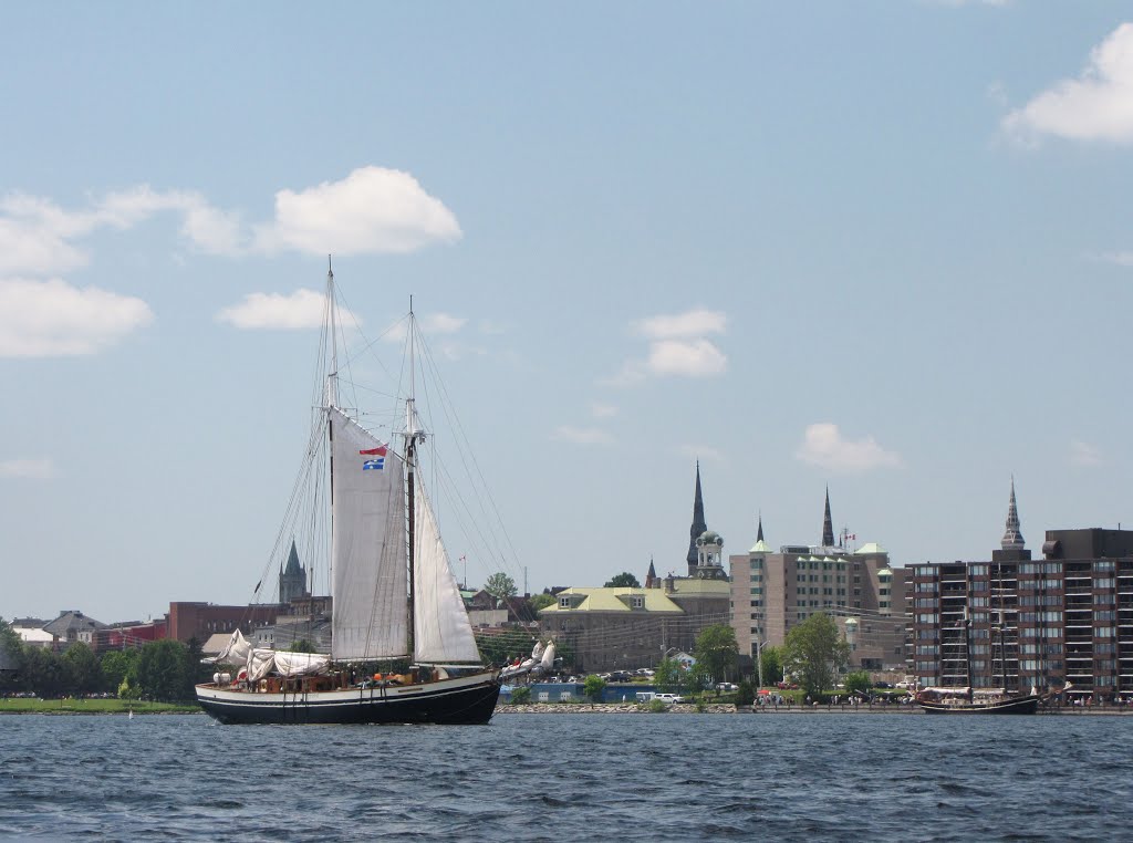 Mist of Avalon sails in front of Brockville.   The water is 35 m. deep here, it is 48 m. deep 3 km. upstream between Stoven and Sparrow Islands and the main land. June 14, 2013.   One place near Rockport upstream is 77 m. deep.