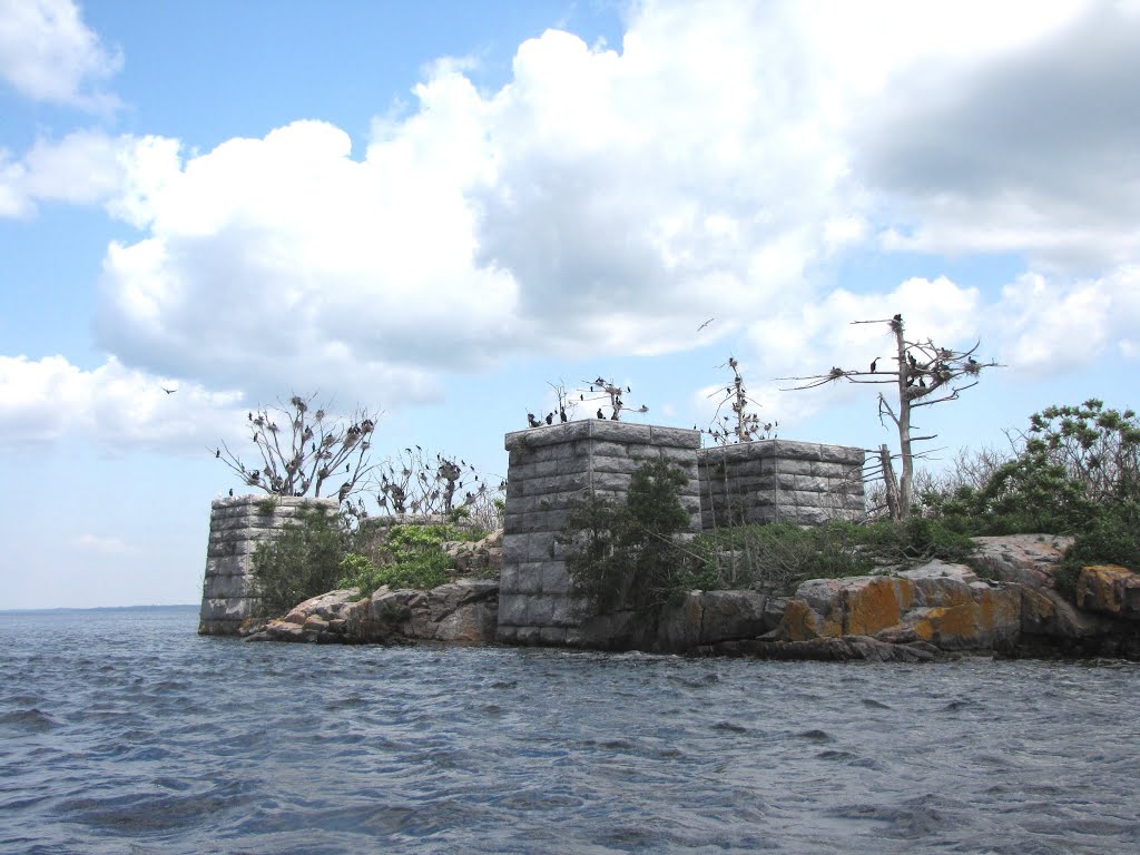 Massive stone foundation  built some time after 1889, for a proposed railway bridge for the Brockville and Westport Railway  (B&W) to ship lumber to the US east coast and Europe.   They intended to use 3 small islands for the base. This is as far as they 