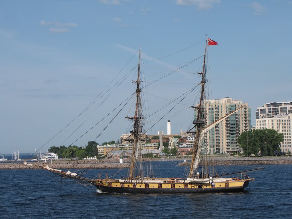 The British ship Royal George, played by the U.S. Niagara in the re-enactment of the war of 1812 sails in front of the condo tower, the Royal George.  June 30 2012.  This ship spent the night beside the Holiday Inn, where the original ship was pounded by 
