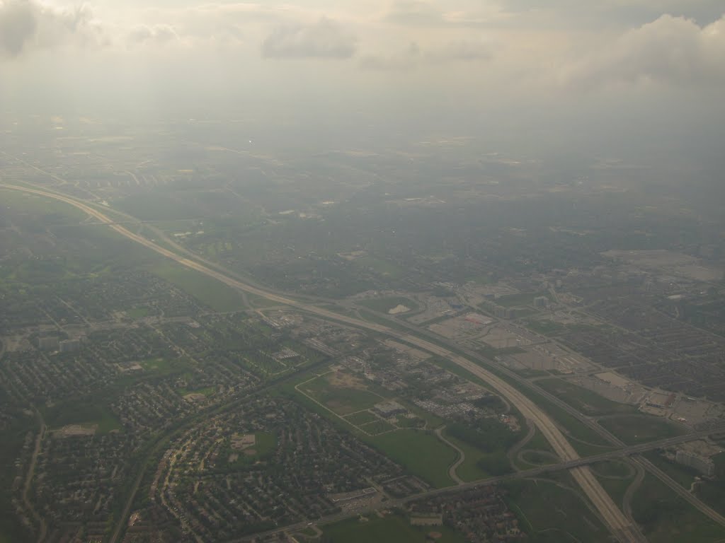 Looking Down At A Freeway And Suburban Homes In Toronto May 11