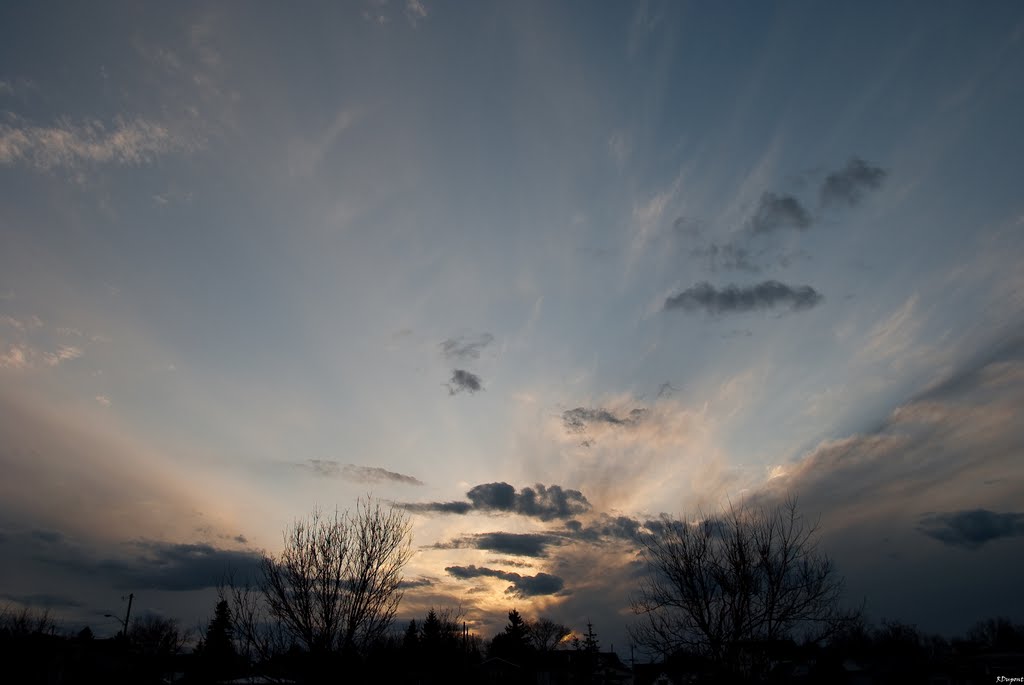 Rain clouds moving in at sunset