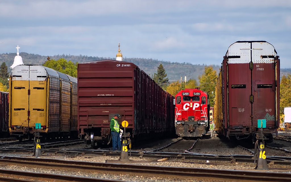 Train crew switching cars.