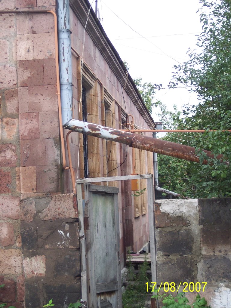 A house built with traditional rose and orange tuff...
