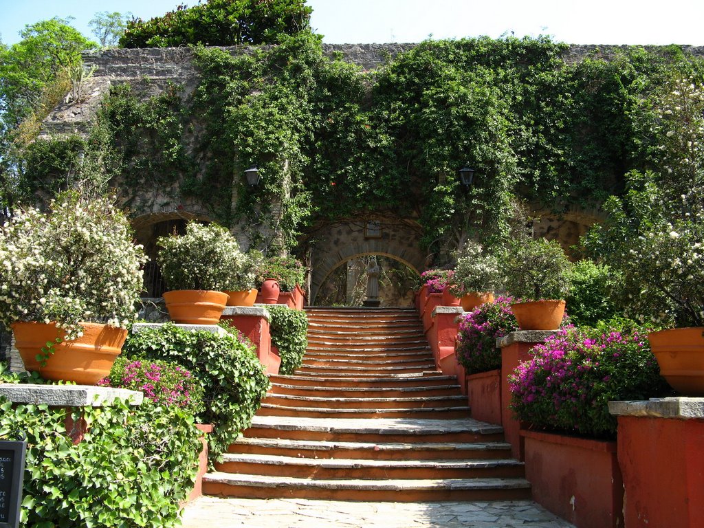 Flower lined stairs in the garden of museo de San Gabriel De Barrera