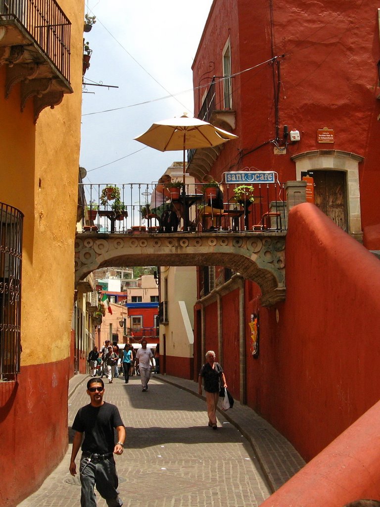 Santo Café with tables on the small bridge above a pedestrian alley