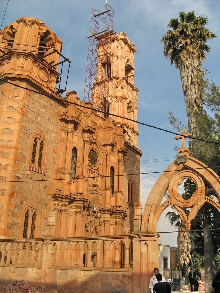 A church undergoing restoration of the towers
