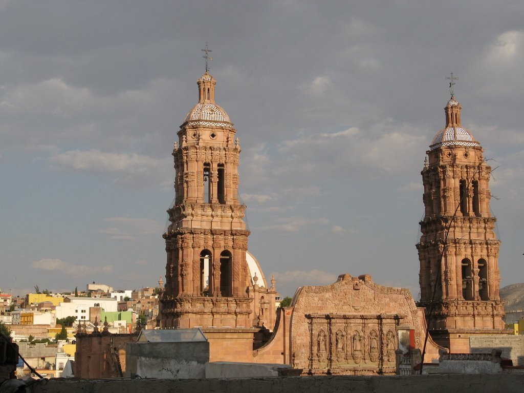 The towers of the cathedral behind a rooftop