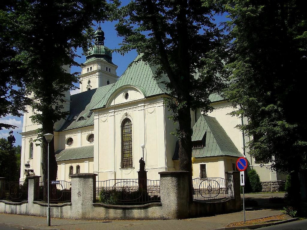The neo-barogue Holy Family Church, built in the years 1912 - 15.Over the facade with an interesting portal you can see towers covered with helmets with lanterns.The interior is divided to three barrel-vaulted naves decorated with murals in the baroque st