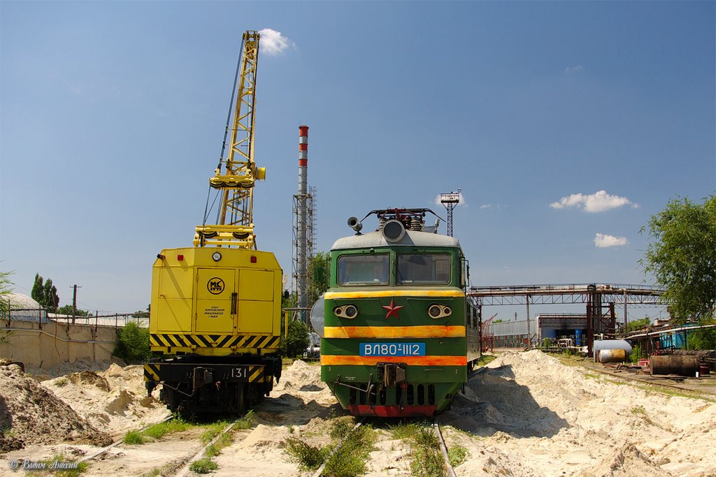 Electric locomotive VL80T-1112 with crane near depot of the train station Salsk