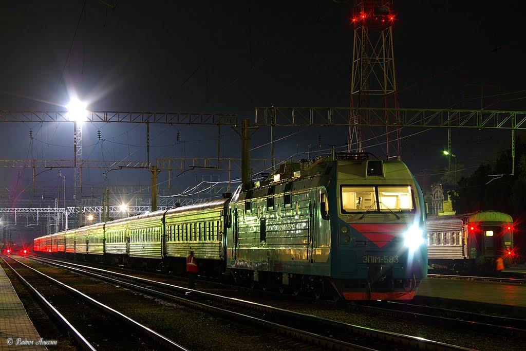 Electric locomotive EP1M-583 with train on train station Mineralnye Vody