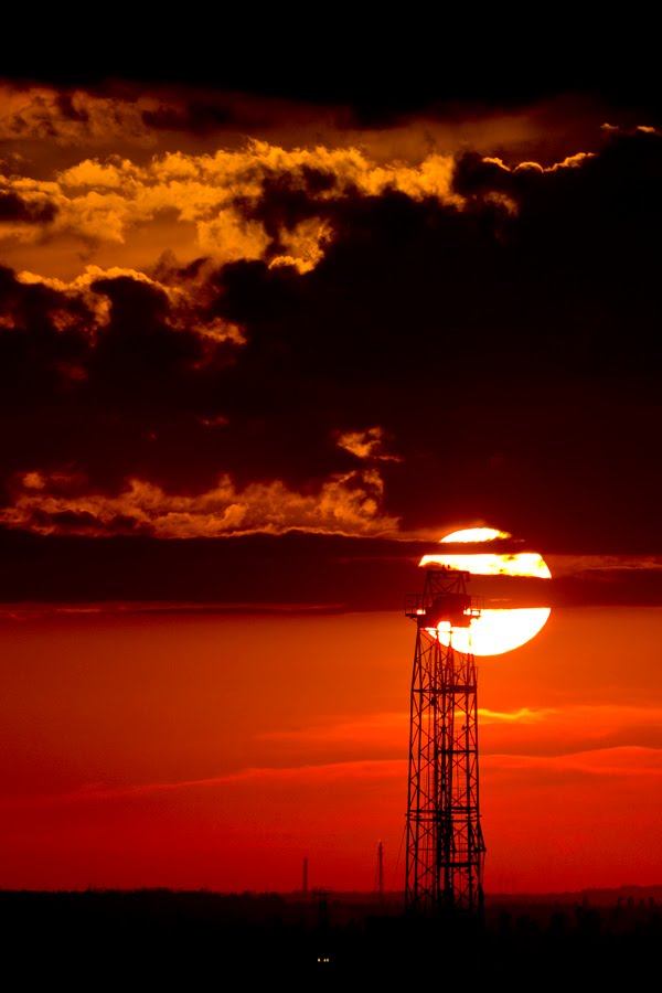 Drilling rig at sunset