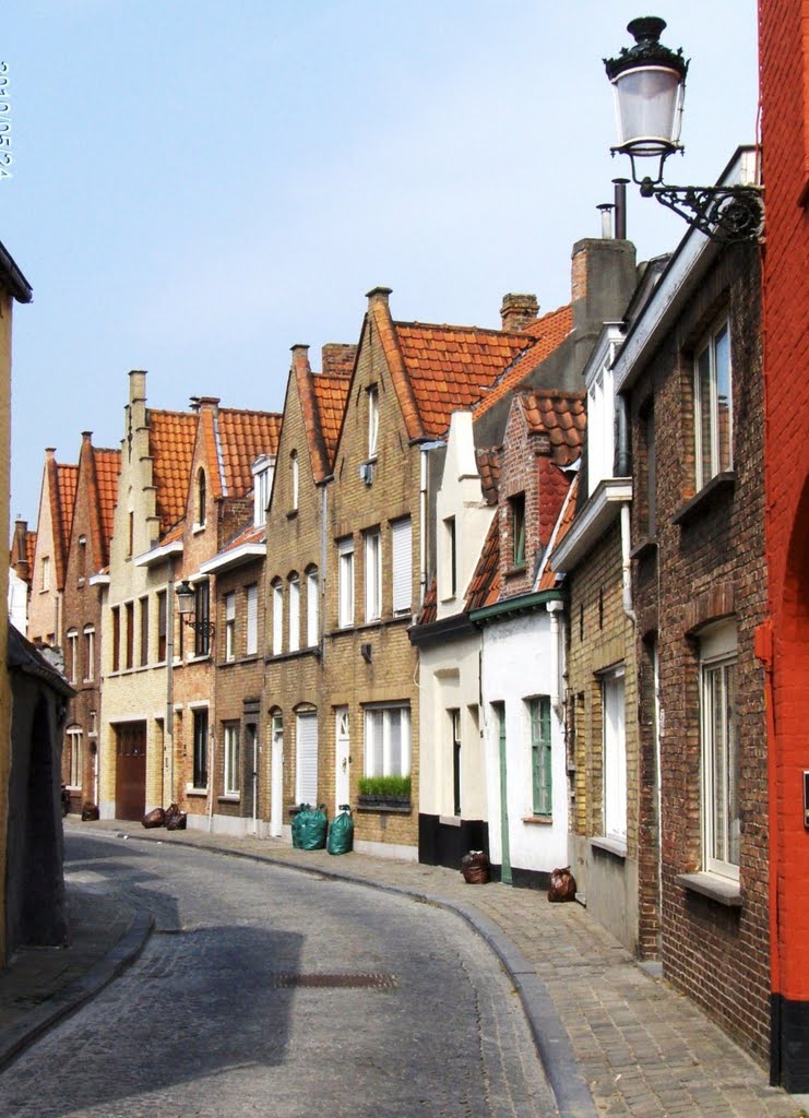 a narrow street, in Peperstraat, Bruges, Belgium -the whole city of Bruges is a UNESCO Heritage site 2000