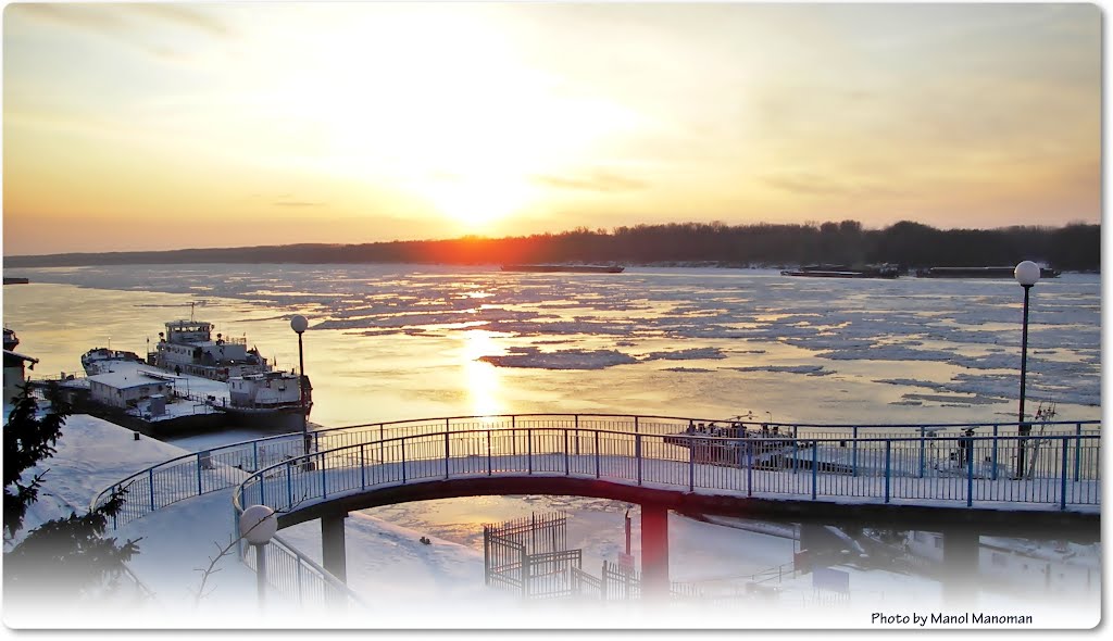 Winter sunset over the icy river