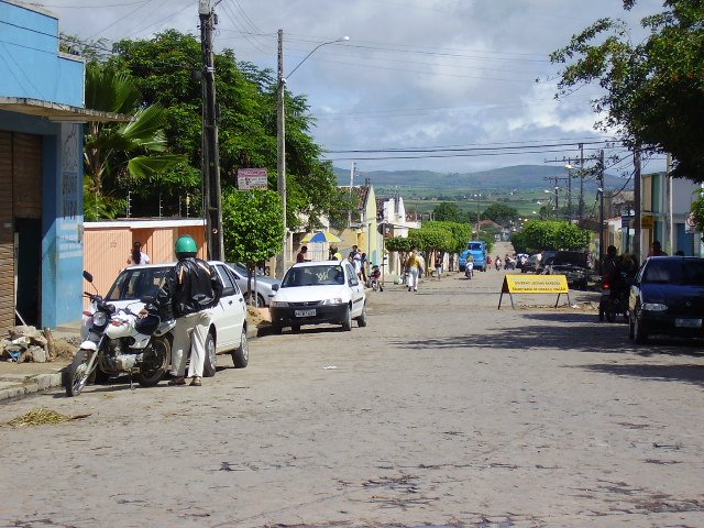 Car, people, houses, hills, electricity and sky...