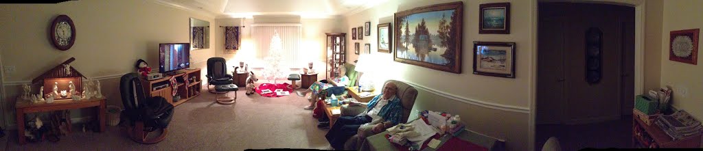 Panoramic shot of their living area.  On the right is the doorway to the hallway.  Left in the hallway is their bedroom, right is the guest bedroom and bathroom.  On the left is the door to the garage.