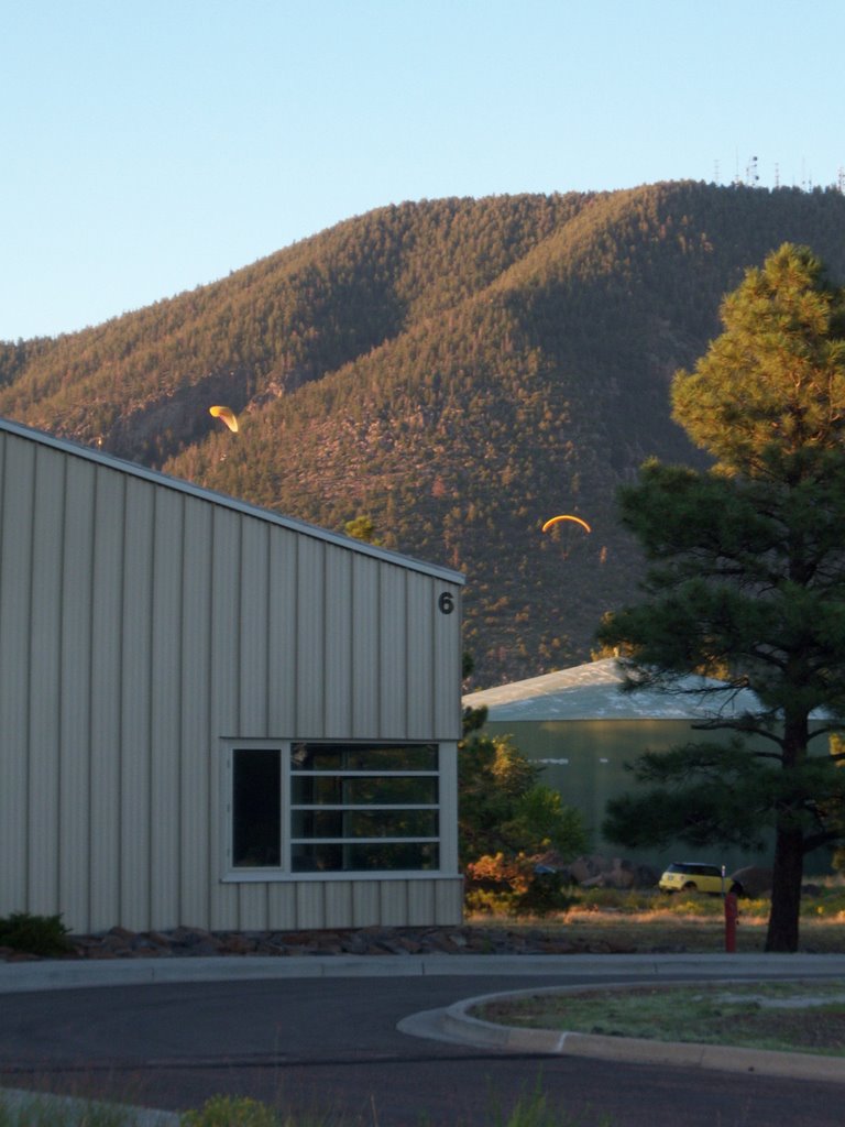 Parasailers coming into Buffalo Park from Mt. Elden, near the USGS Shoemaker building