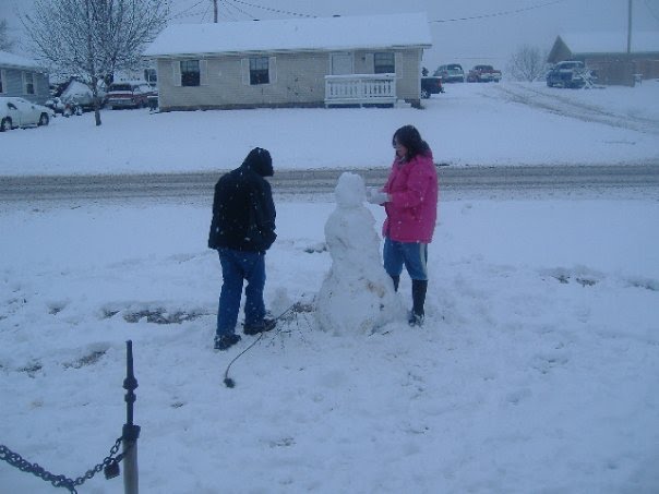 Our son and Daughter Making a Snowman