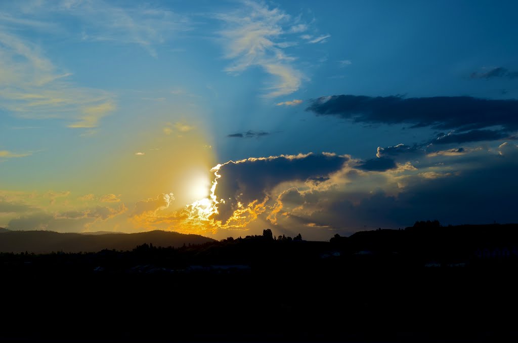 Storm clouds clearing over Omak. The wind blew so hard the shopping carts were racing around the Safeway parking lot.