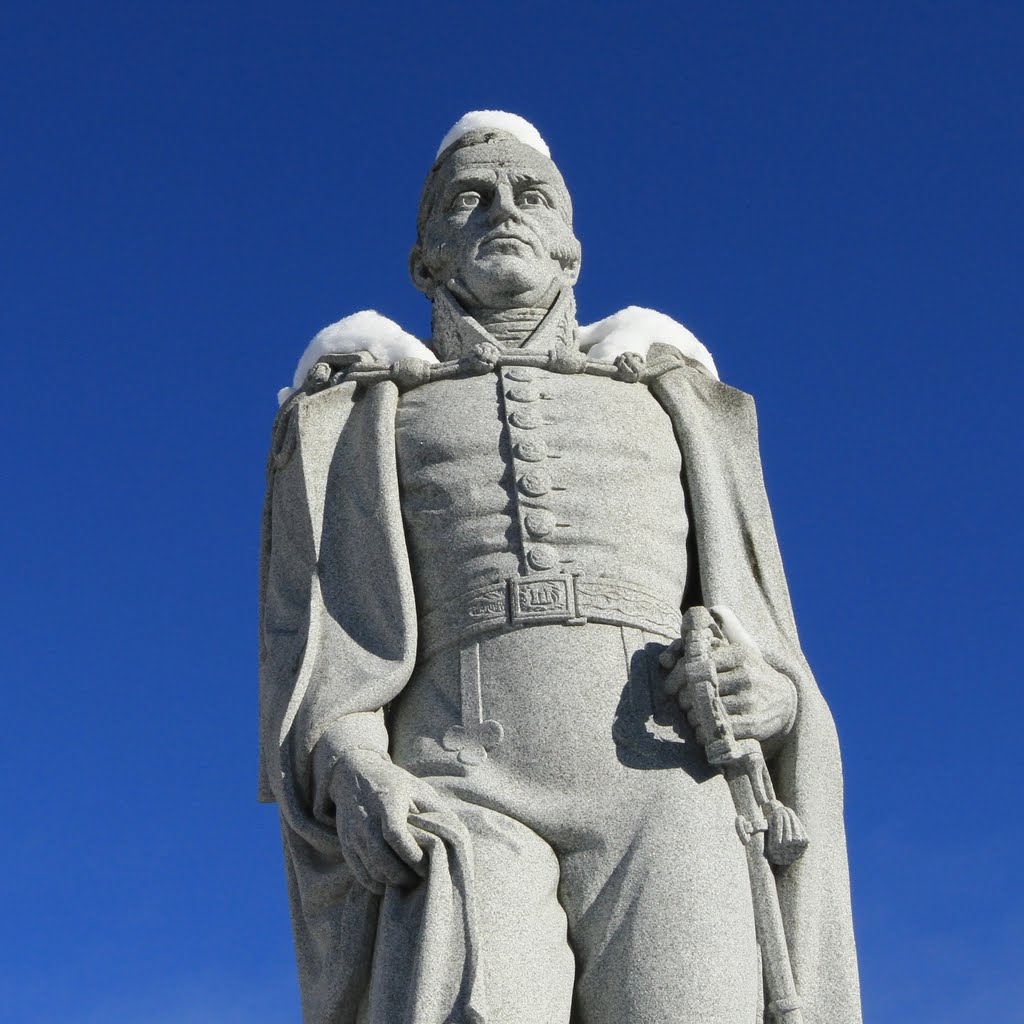 Snow sits on the shoulders and head of the statue of Norwich University founder Alden Partridge.