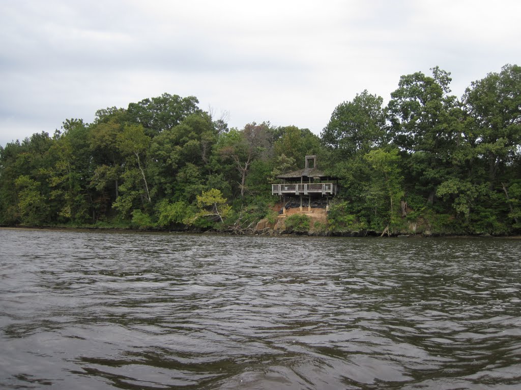 a funky looking gazebo on the shore of the occoquan