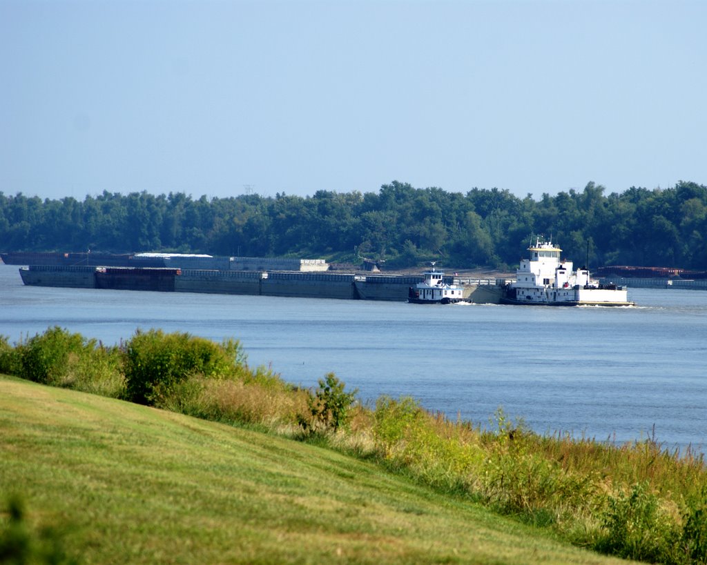 The River Boat Going South Requires Assistance From A Smaller Tug. You Can See Her Barges Are Also High In The Water. Probably going To Be Loaded With Some Sort Of Grain...Corn Maybe.