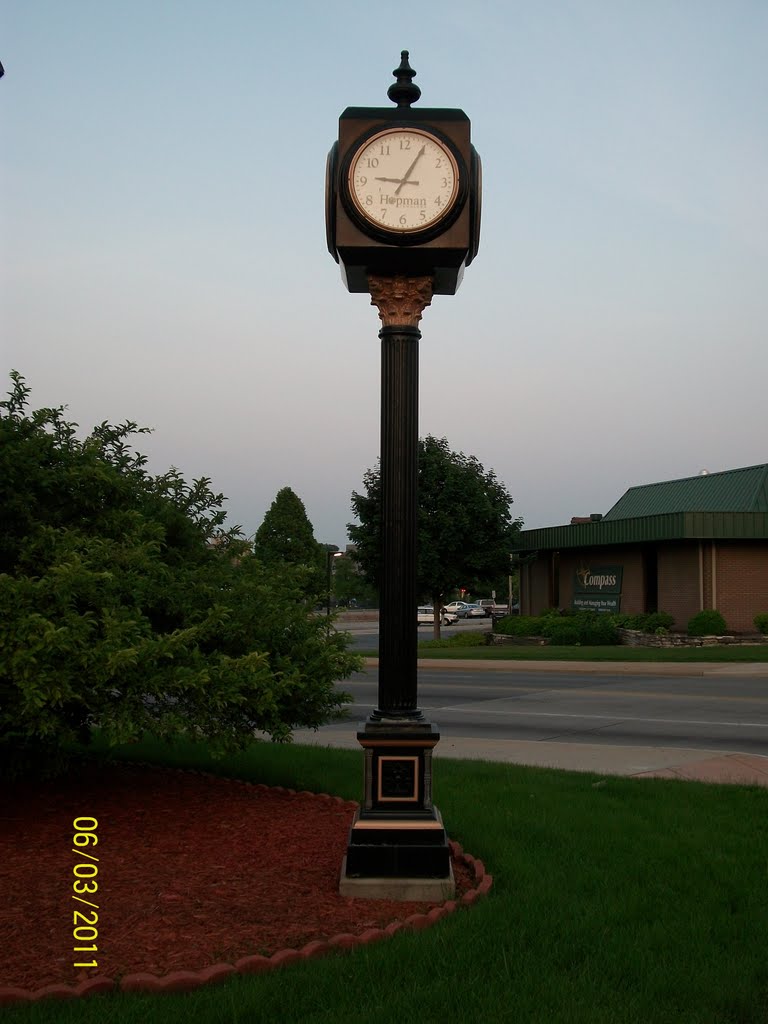 Streetside clock by jewelry store near sunset; Elkhart, IN