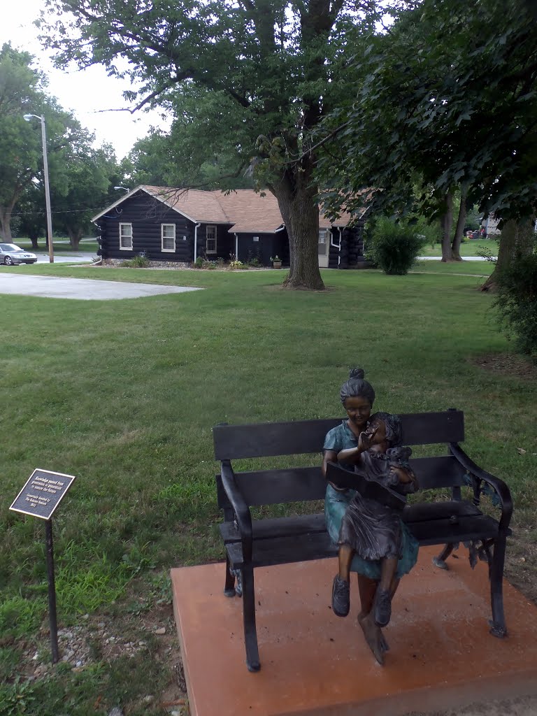 Reading statue in front of Girl Scouts cabin
