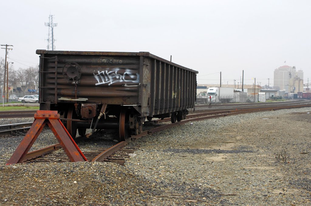 An empty scrap car sits on a spur off of the mainline of the Union Pacific tracks just south of downtown Modesto, 12/2012