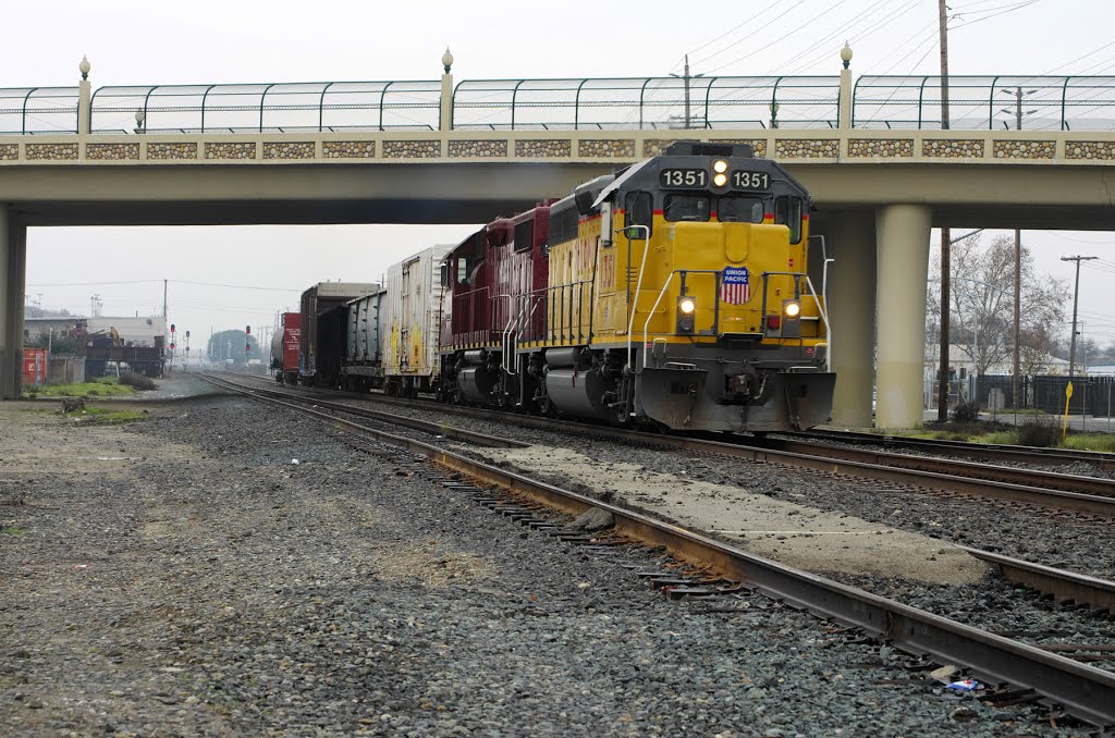 A couple of locomotives haul a short line of freight down the Union Pacific Railroad tracks underneath the P St overpass, 12/2012