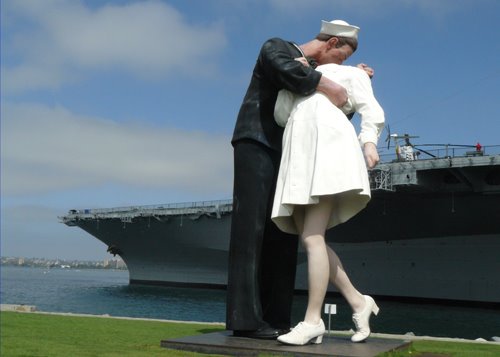 Kissing in front of USS Midway in San Diego