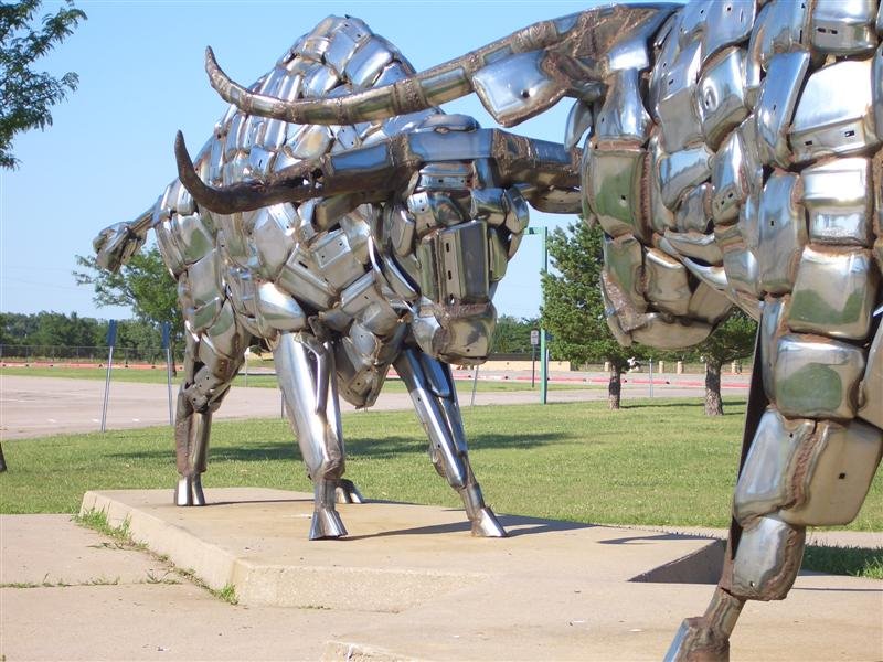 Two Steers  by John Kearney, also called Bumper Bulls, 2 life-size bulls made of vehicle bumpers, Kansas Coliseum, Wichita,KS