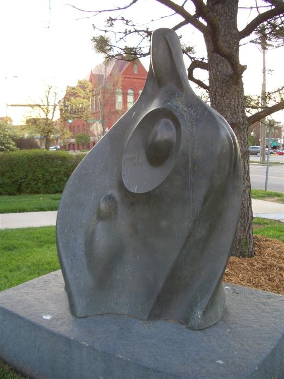 Leadership, abstract bronze of children encircled in mothers cloak, Lawrence, KS