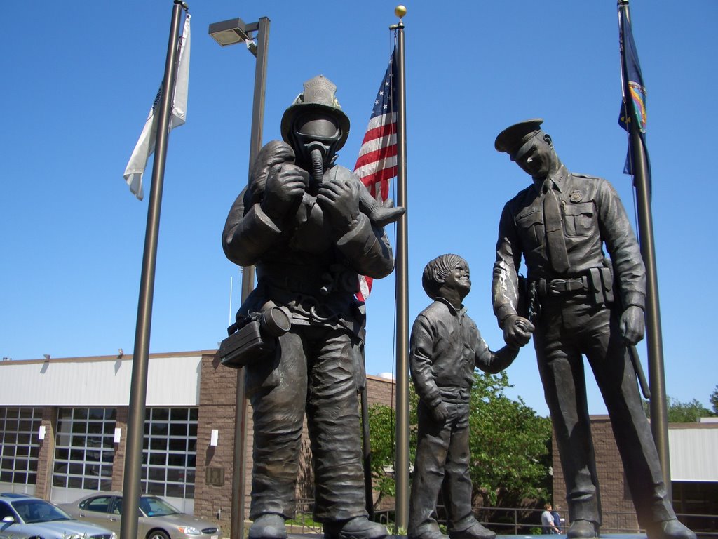 Protectors, Police Officer Firefighter Memorial, bronze of fireman with girl and boy looking up to police officer, Shawnee Safety Center, Shawnee,KS
