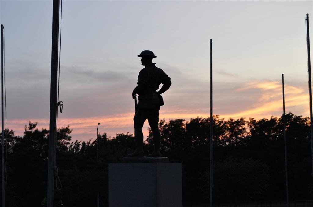 World War I bronze soldier against sunset, Olathe Memorial Cemetary, Olathe, KS