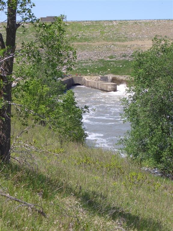 Tuttle Creek Dam spillway, left side people are fishing, right outlet letting out water, Manhattan, KS