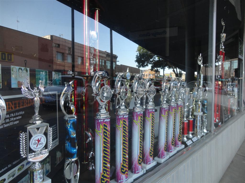 trophies in the window, downtown Salina, KS