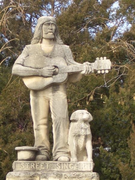 Street Singer, life-size Pete Felten limestone carving, Hays, KS